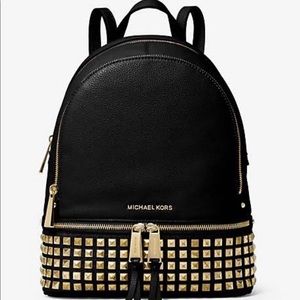 Like new- Leather Michael Kors Rhea medium zip black studded backpack